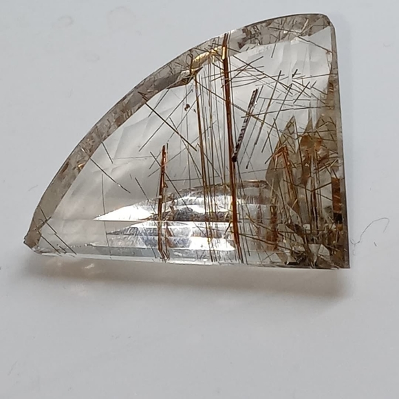 A dazzling freeform rutilated quartz cabochon - Picture 1 of 3